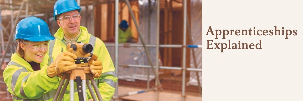 Man and young female apprentice on construction site